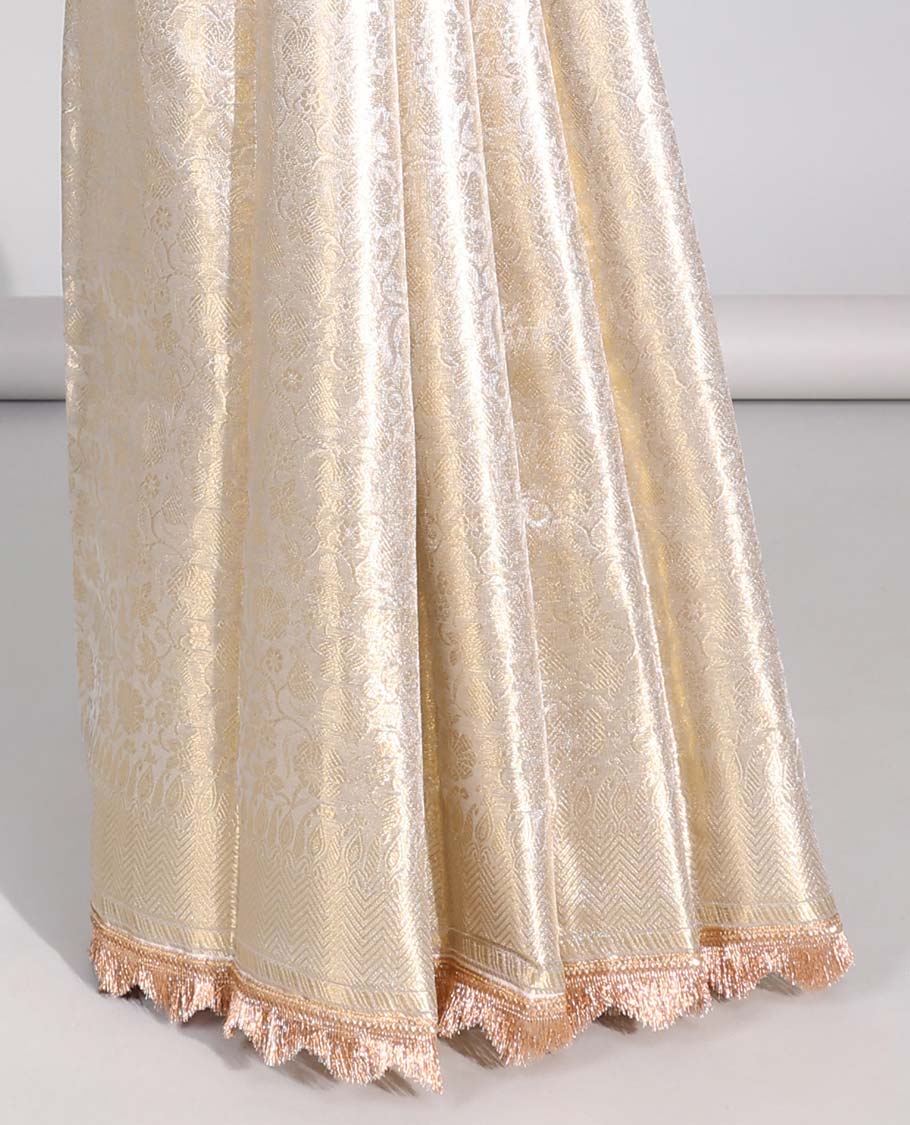 Cream floral jacqaurd tissue saree with self zari design & intricate zari design pallu
