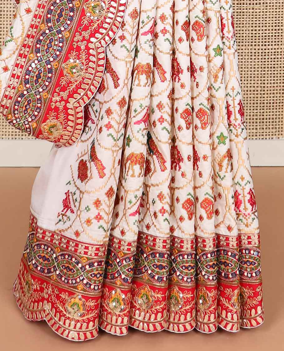 White ikkat style thread embroidery tussar silk saree with embroidery scallop border & floral ikkat style pallu