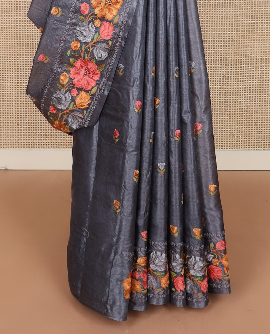Cement grey floral motifs, multi-color thread embroidered tussar saree, floral vine thread embroidered border, and pallu