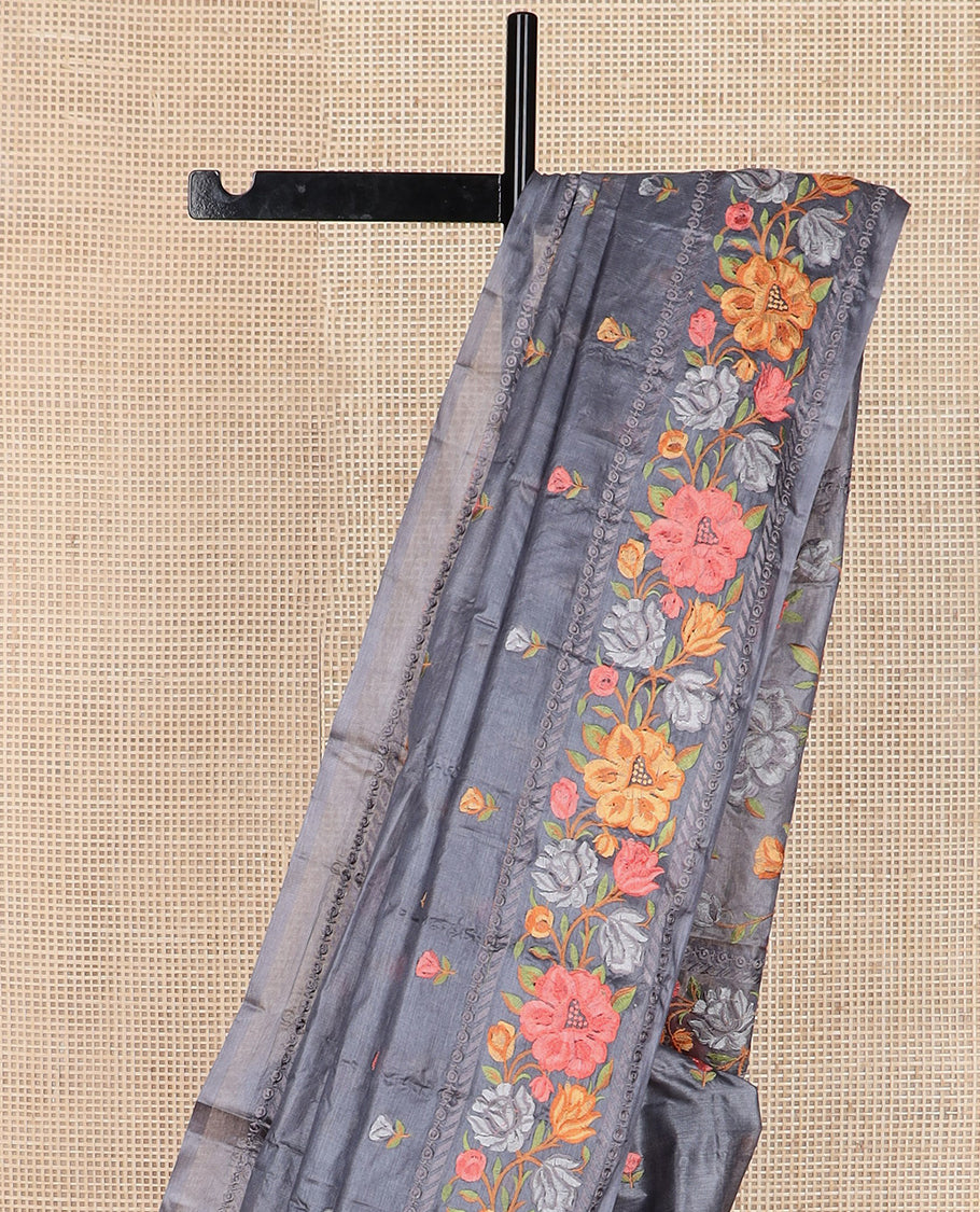 Cement grey floral motifs, multi-color thread embroidered tussar saree, floral vine thread embroidered border, and pallu