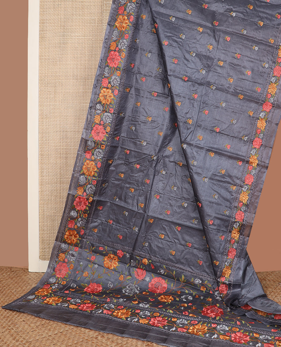 Cement grey floral motifs, multi-color thread embroidered tussar saree, floral vine thread embroidered border, and pallu