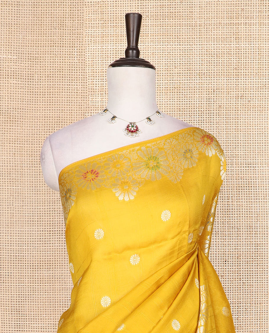 Yellow flower buttas Matka silk saree, scallop floral meenakari zari woven border, and pallu of stripes, and floral meenakari designs