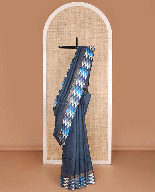 Blue tussar saree with buttas, contrast pochampally ikkat-style geometric patterned border & pallu