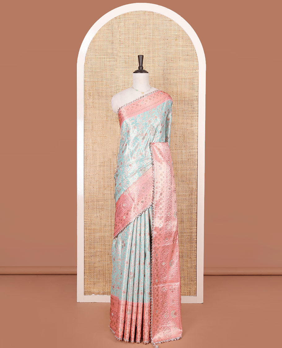 Blue Vastrakala Silk Saree Elegantly Highlighted with Floral Jacquard and Stone Work, Complemented by Contrast Traditional Zari and Stone Embroidered Scallop Border, Mughal-Style Zari Woven Stone Work Pallu, and Paired with Contrast Stone Work Blouse