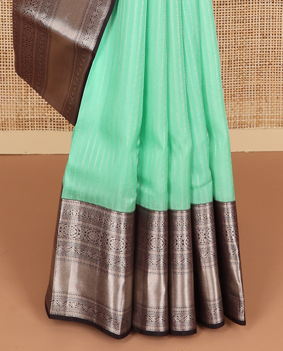 Mint green sriped vasundhara elite silk saree with contrast intricate zari design border & floral jaal design pallu