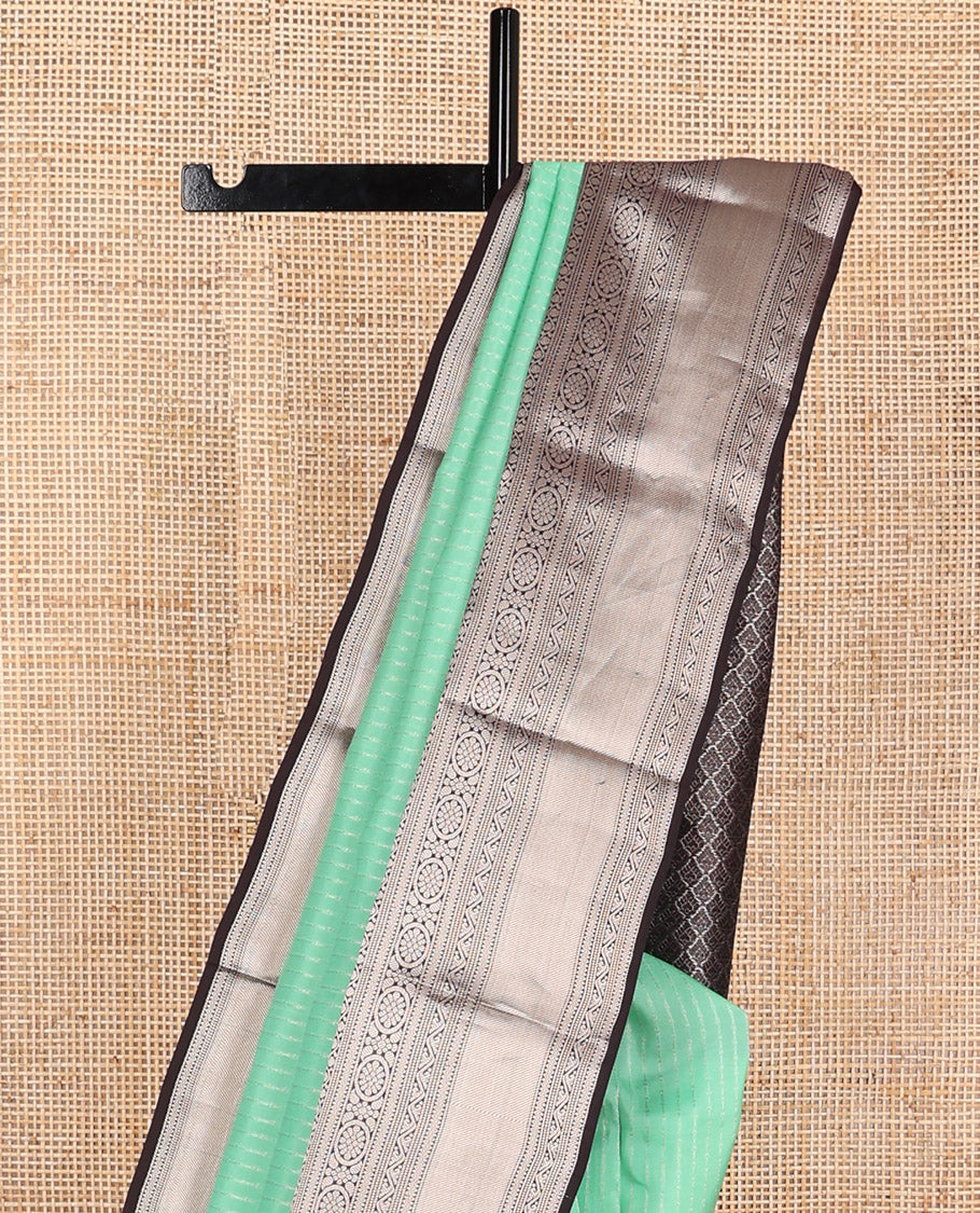 Mint green sriped vasundhara elite silk saree with contrast intricate zari design border & floral jaal design pallu