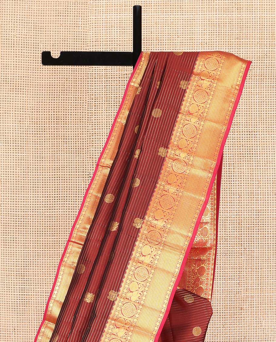 Maroon Vasundhara Lite Silk Mix Saree, Mesmerized with Annam-Chakram Butts and Stripes on Its Body, Complemented by Contrast Border of Thazampoo Rekku, Muthu, Rudraskham, Mayil, and Muthu Designs, Grand Jaal Pallu, and Paired with a Contrast Blouse