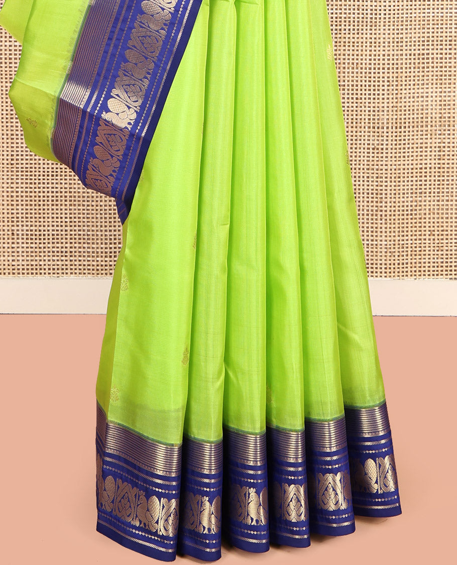 Green Vasundhara Lite Silk Mix Saree, Sparsely Sparkled with Zari Buttas, Complemented by a Contrast Zari Border of Mayil Design, Pallu of Mayil Designs, and a Contrast Blouse