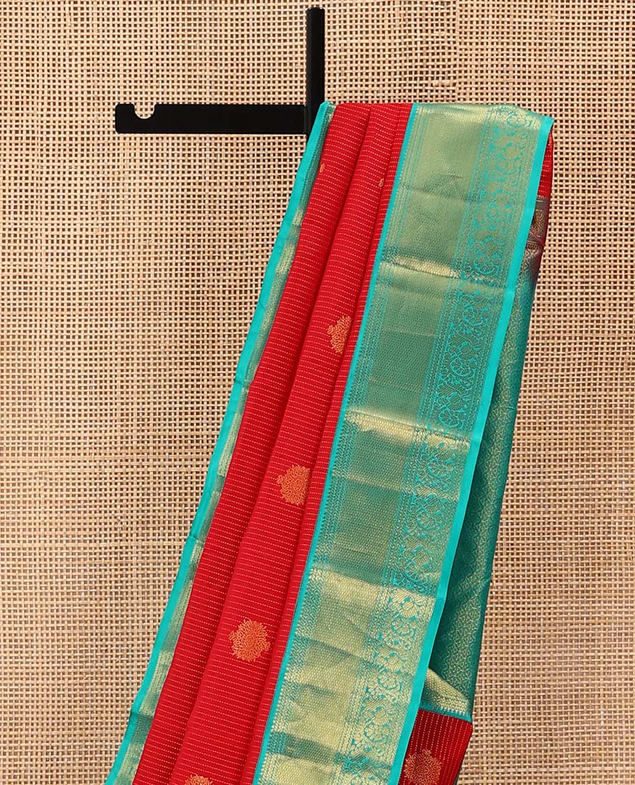 Red Vasundhara Lite Silk Mix Saree Gracefully Embellished with Zari Buttas and Stripes, Complemented with a Contrast Border Featuring Rekku, Banaras, Neli, Mayil Kann, Kodi Visiry, and Mayil Designs, Intricately Decked Up Pallu, and a Contrast Blouse