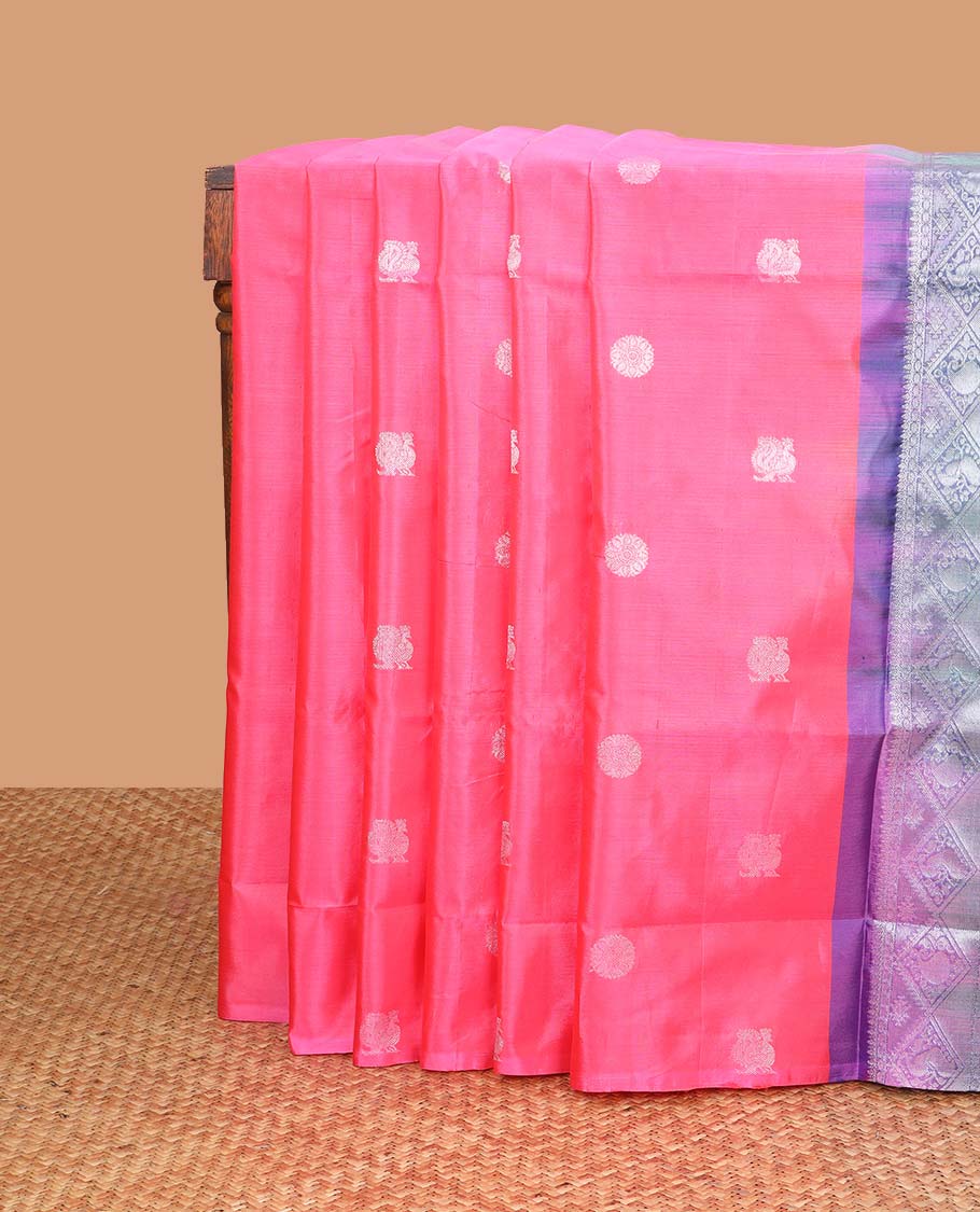 Borderless pink motifs banana pith saree with geometric, peacock design pallu
