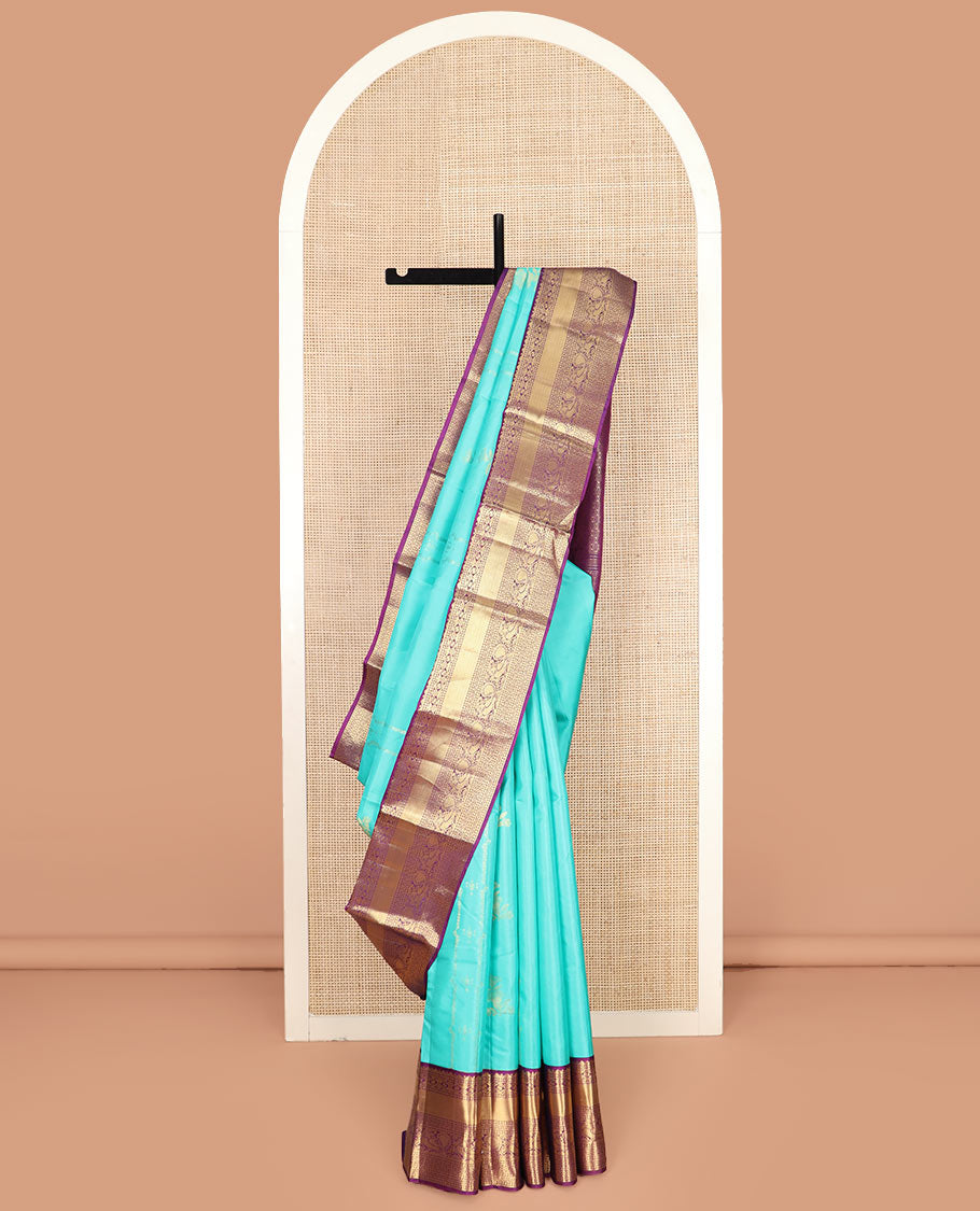 Blue Vasundhara Silk Saree Prettified with Zari Buttas, Complemented by a Contrast Blouse of Banaras, Paisa, Diamond, and Mayil Designs, Grandly Woven Pallu of Jaal Designs, and a Contrast Zari Bordered Blouse