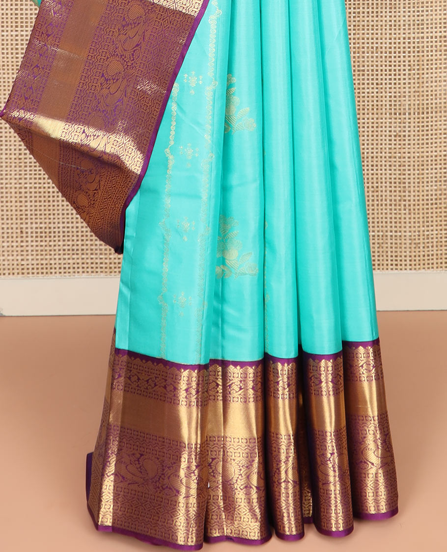 Blue Vasundhara Silk Saree Prettified with Zari Buttas, Complemented by a Contrast Blouse of Banaras, Paisa, Diamond, and Mayil Designs, Grandly Woven Pallu of Jaal Designs, and a Contrast Zari Bordered Blouse