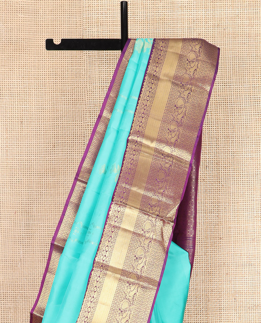 Blue Vasundhara Silk Saree Prettified with Zari Buttas, Complemented by a Contrast Blouse of Banaras, Paisa, Diamond, and Mayil Designs, Grandly Woven Pallu of Jaal Designs, and a Contrast Zari Bordered Blouse