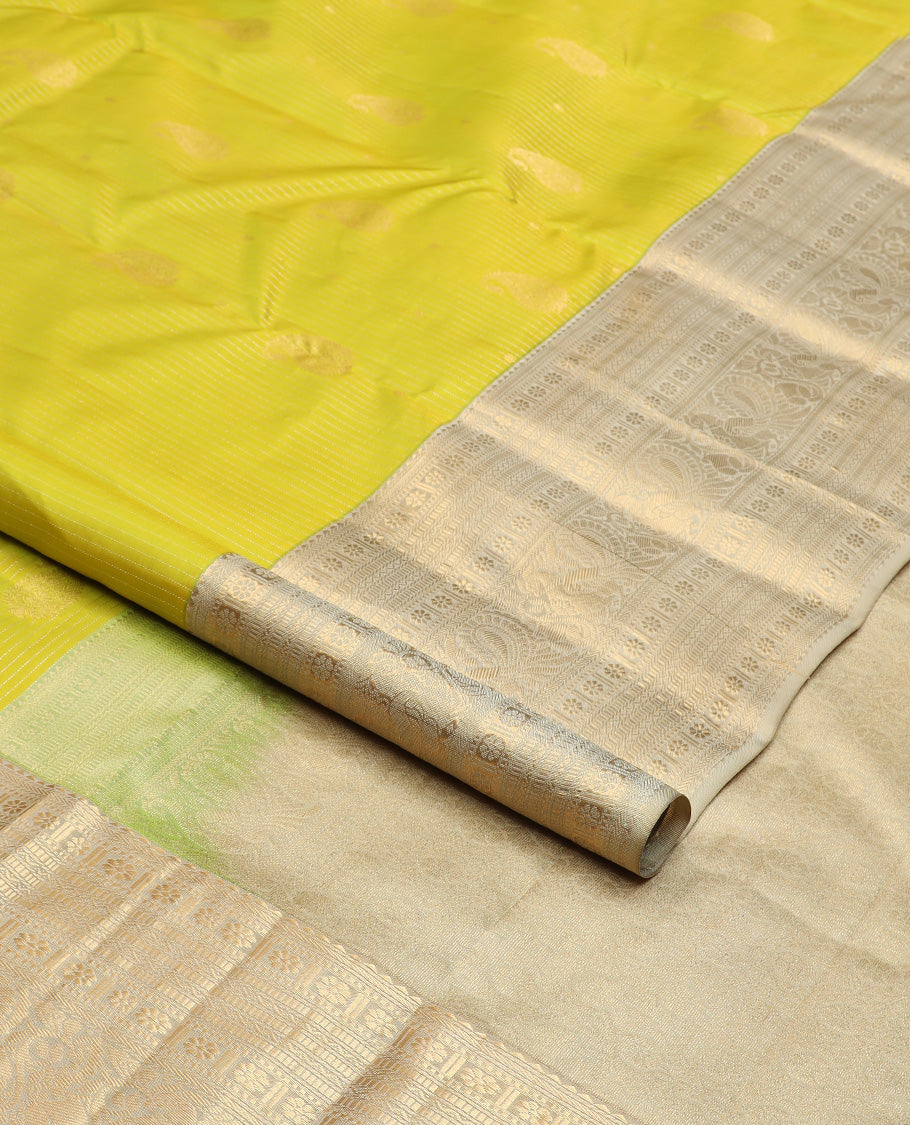 Yellow zari design silk saree, contrast border of rekku, banaras, kamalam, neli, and mayil designs, and intricate pallu