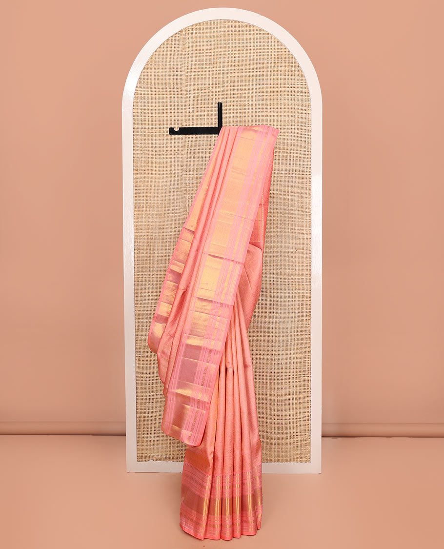 Pink Kanchipuram Wedding Silk Saree, Detailed with Jacquard Design on Its Body, Highlighted by Zari Border of Thilakam Mokku, Muthu, Mayil Kann, Yaanai, and Chakram Designs, Pallu of Mayil Kann Designs, and Paired with a Matching Blouse