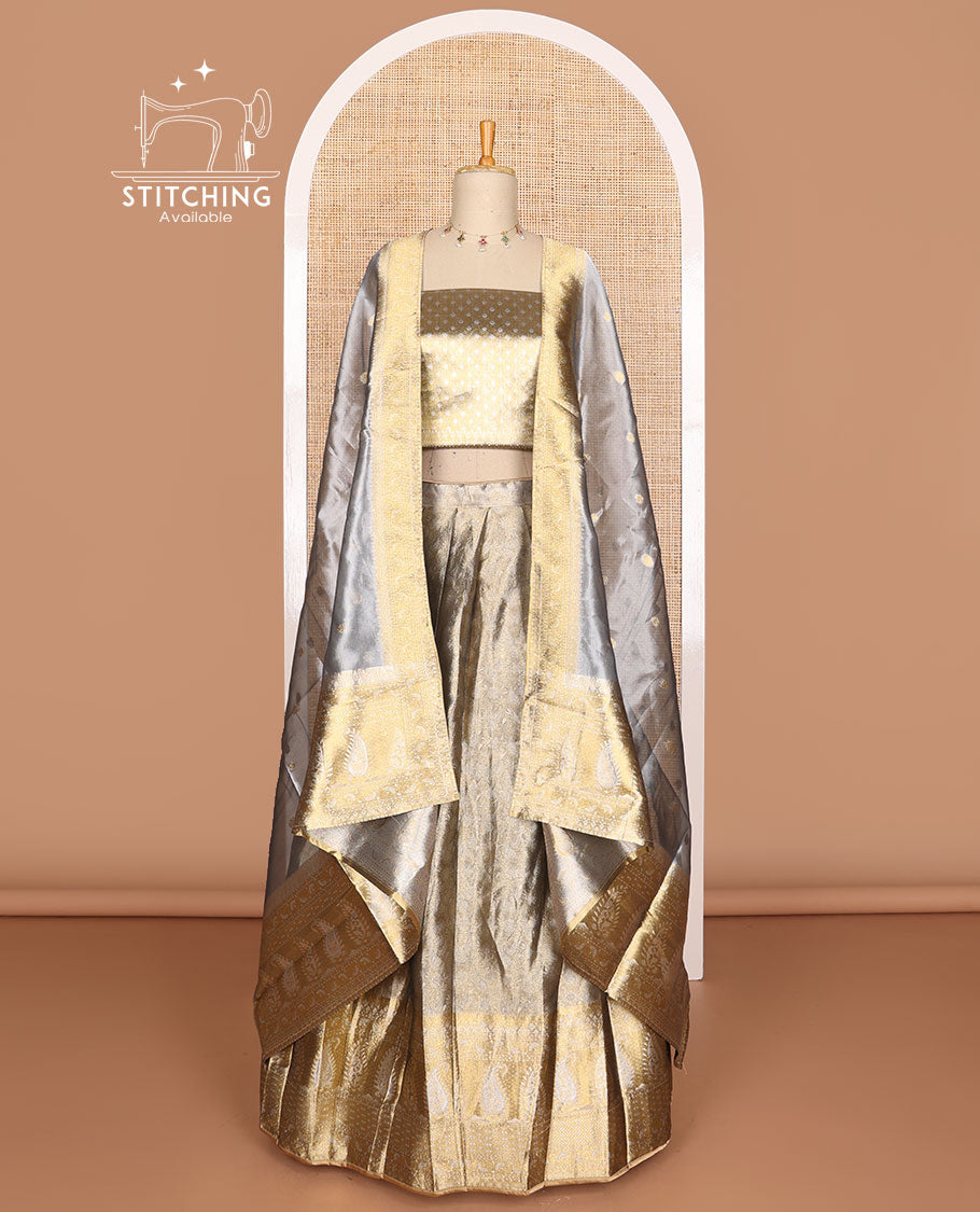 Grey buttas tissue half saree with contrast zari design border, checked zari design blouse & floral design dhavani