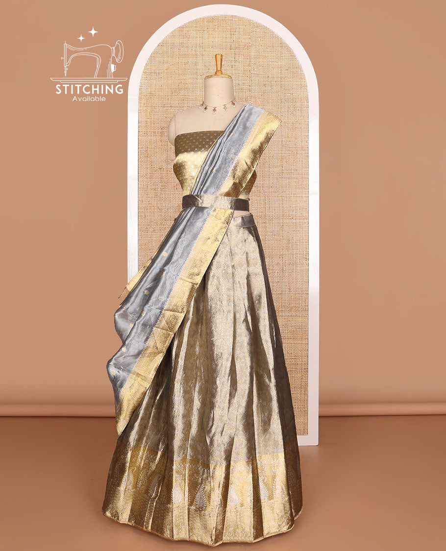 Grey buttas tissue half saree with contrast zari design border, checked zari design blouse & floral design dhavani