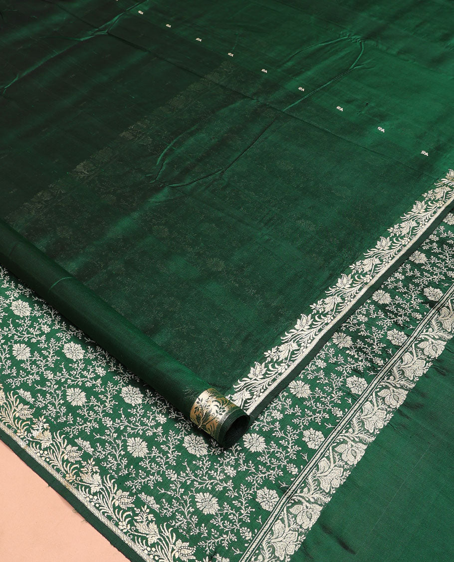 Dark green buttas kathan silk saree, floral creeper border, and Mughal-style floral jaal pallu