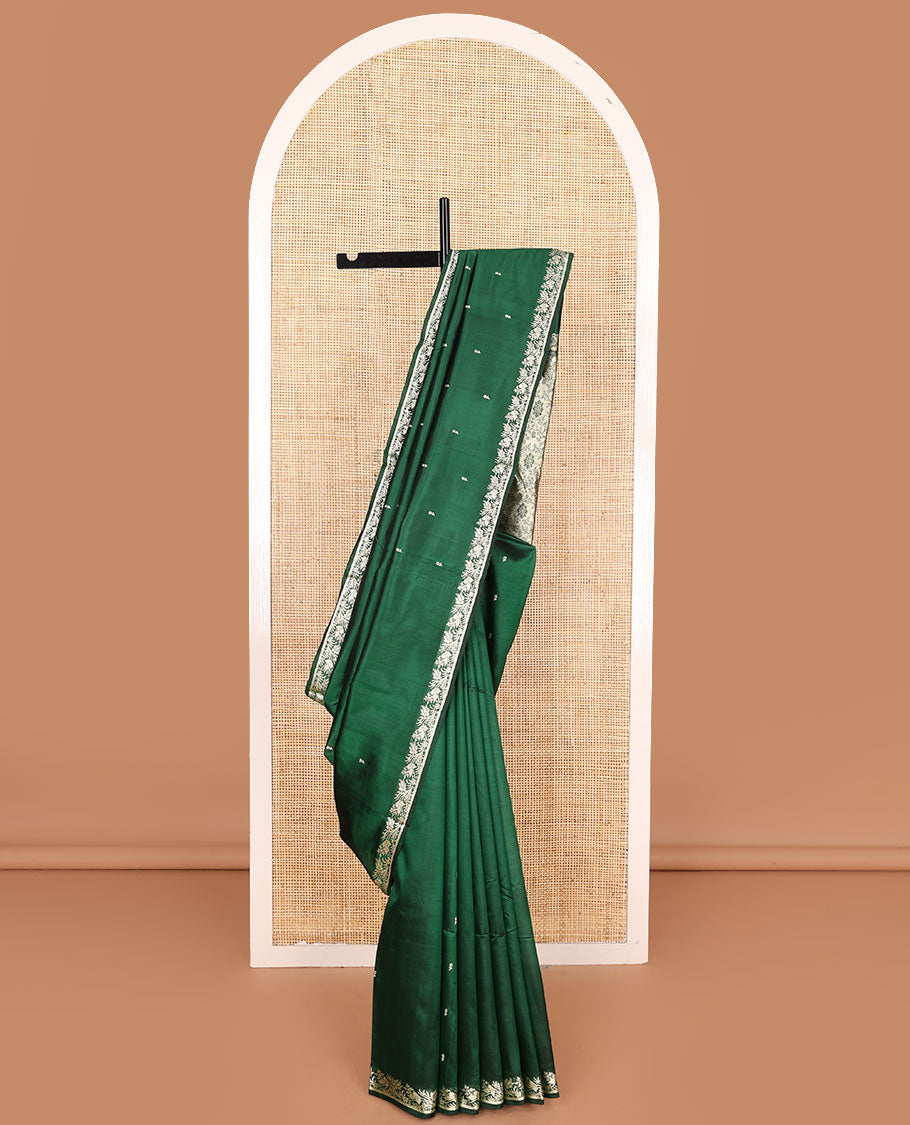 Dark green buttas kathan silk saree, floral creeper border, and Mughal-style floral jaal pallu