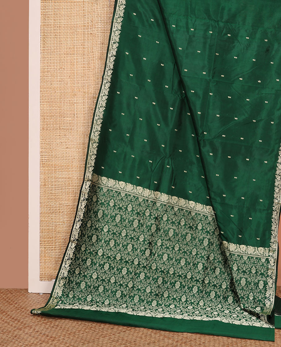 Dark green buttas kathan silk saree, floral creeper border, and Mughal-style floral jaal pallu
