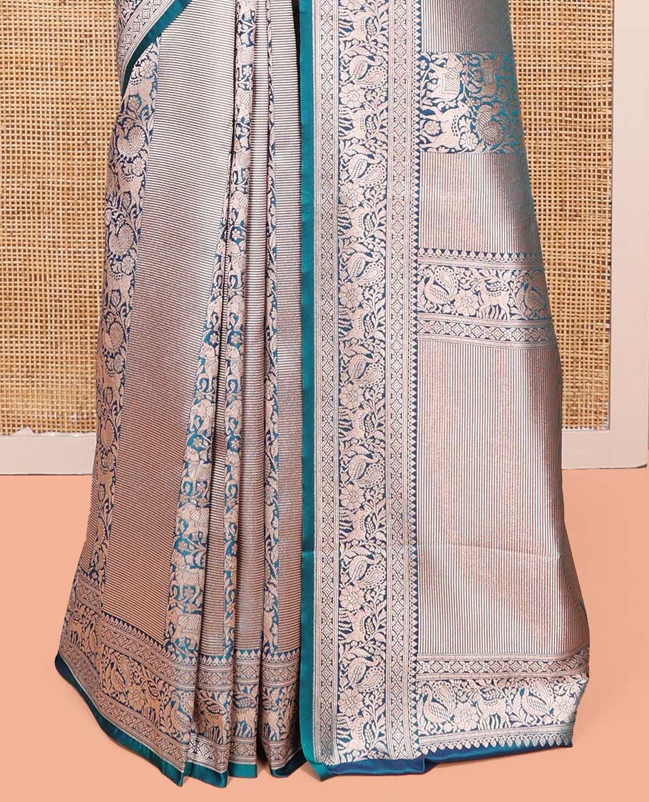 Blue Semi-Banaras Silk Saree, Opulently Embellished with Animal-themed Jacquard Designs on Its Body, Highlighted by a Zari Border of Traditional Designs, Pallu Steeped with Stripes, and Paired with a Matching Blouse