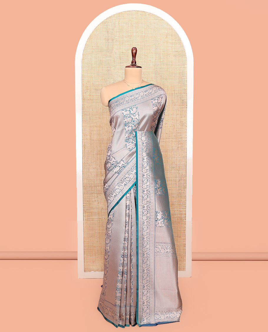 Blue Semi-Banaras Silk Saree, Opulently Embellished with Animal-themed Jacquard Designs on Its Body, Highlighted by a Zari Border of Traditional Designs, Pallu Steeped with Stripes, and Paired with a Matching Blouse