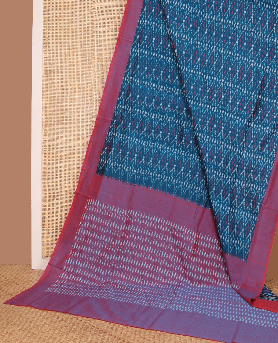 Blue ogee patterned ikkat cotton saree, contrast plain border, and pallu of buttas