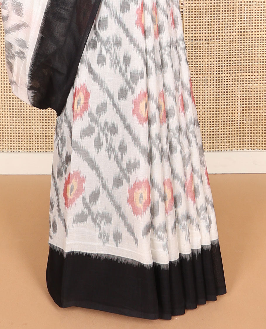 White floral design ikkat cotton saree with contrast border & geometric design pallu