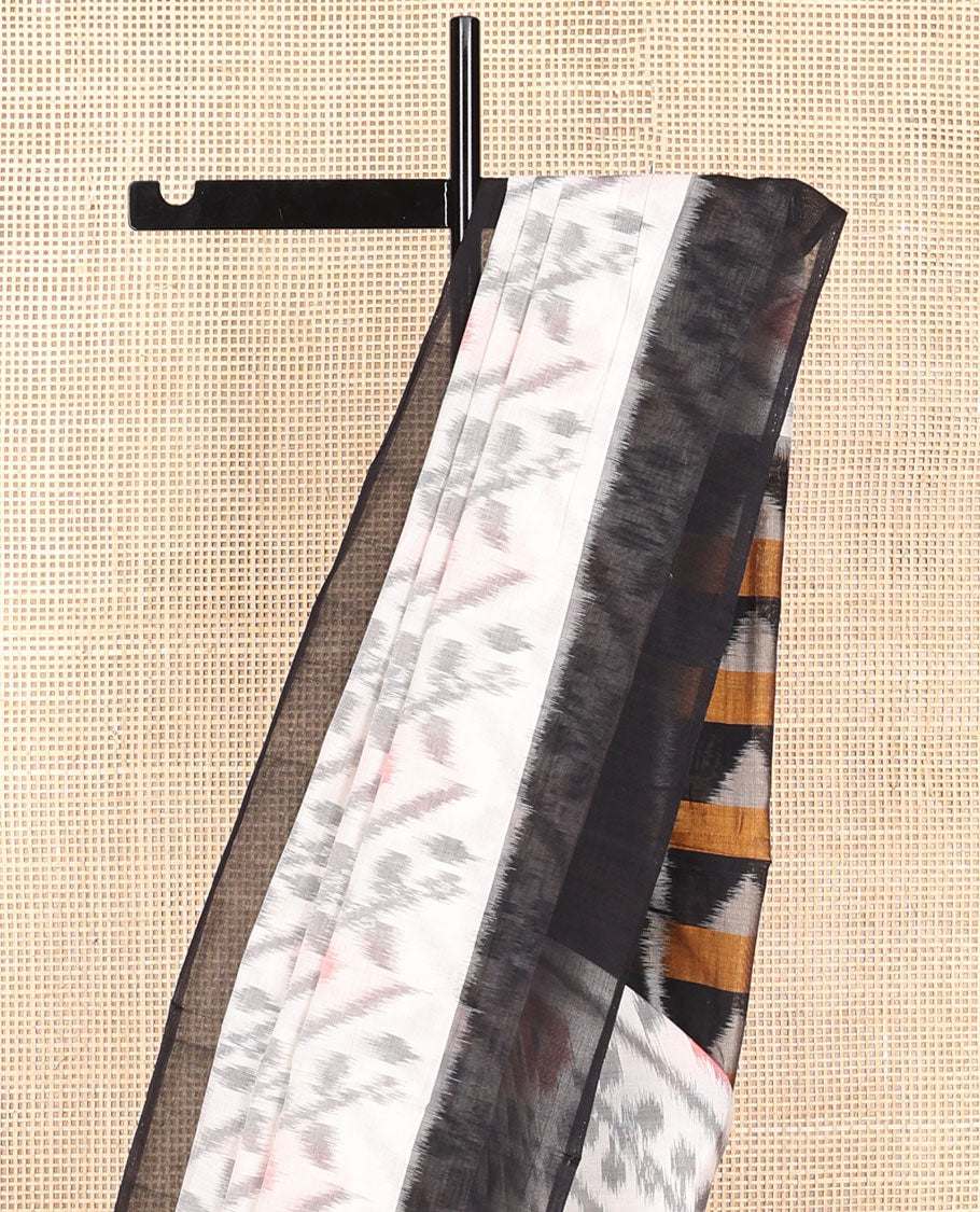 White floral design ikkat cotton saree with contrast border & geometric design pallu