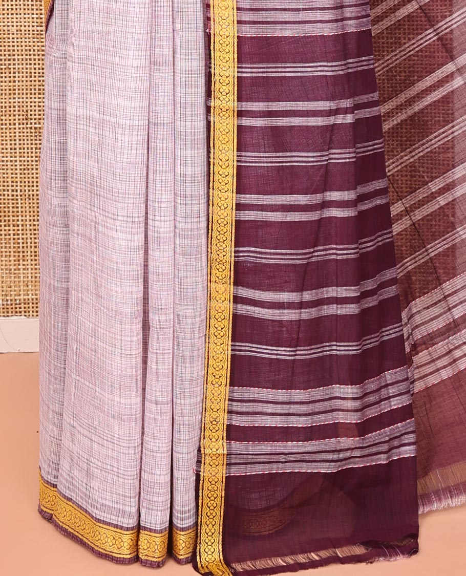 Pale Purple Andhra Cotton Saree, Sparsely Textured Heathered Patterns All Over Its Body, Complemented by Contrast Traditional Border, Pallu Steeped with Stripes, and Paired with a Matching Blouse