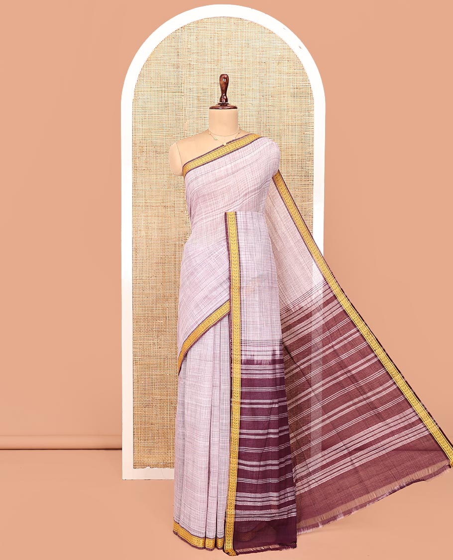 Pale Purple Andhra Cotton Saree, Sparsely Textured Heathered Patterns All Over Its Body, Complemented by Contrast Traditional Border, Pallu Steeped with Stripes, and Paired with a Matching Blouse