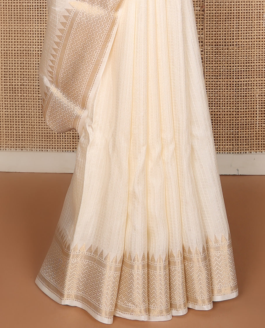 Dazzling white sparsely checked silk saree, traditional zari border, and traditional pallu of paisleys