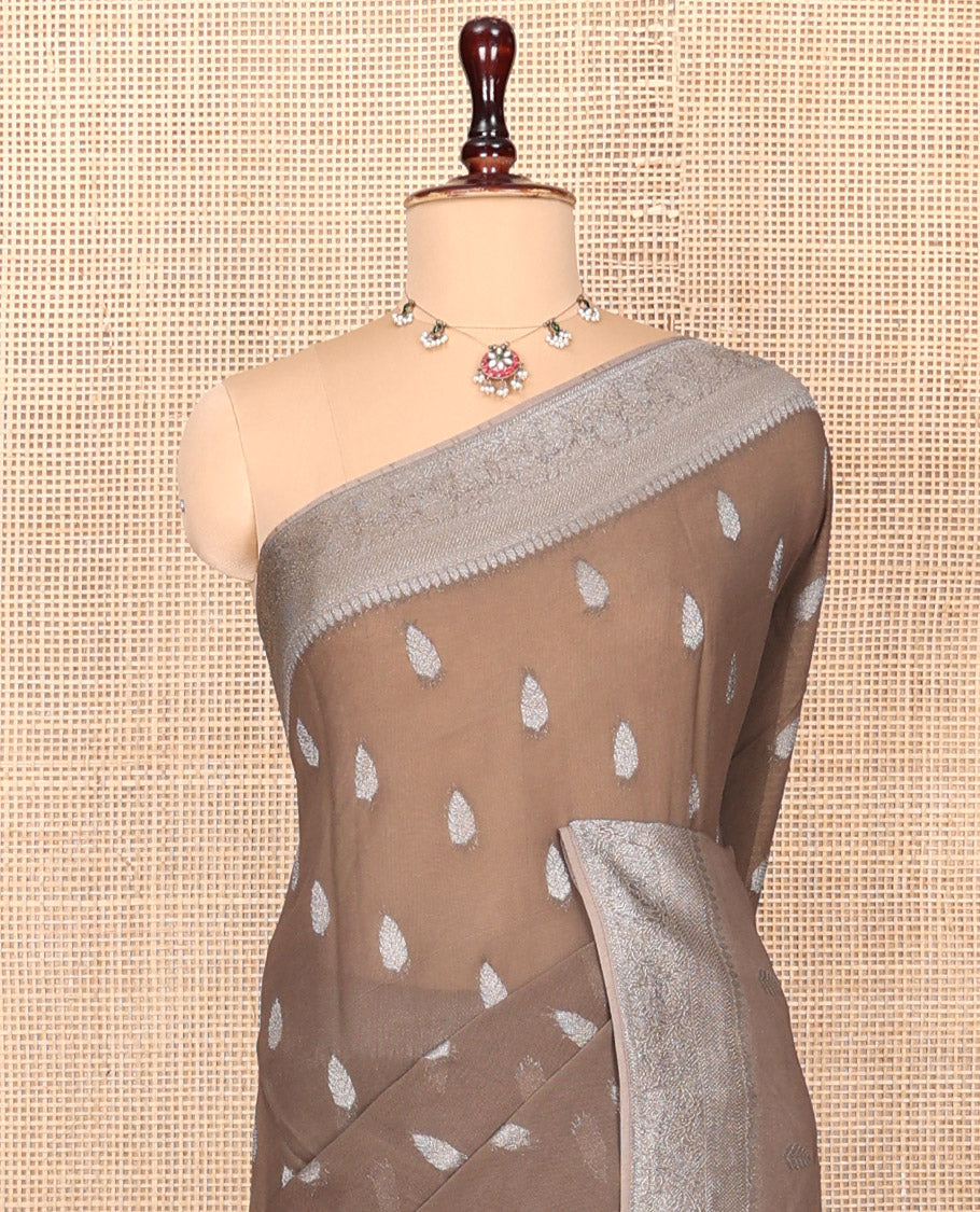 Brown Georgette Saree, Steeped with Buttas, Highlighted by a Traditional Floral Creeper Border, Intricately Designed Pallu, and a Matching Blouse