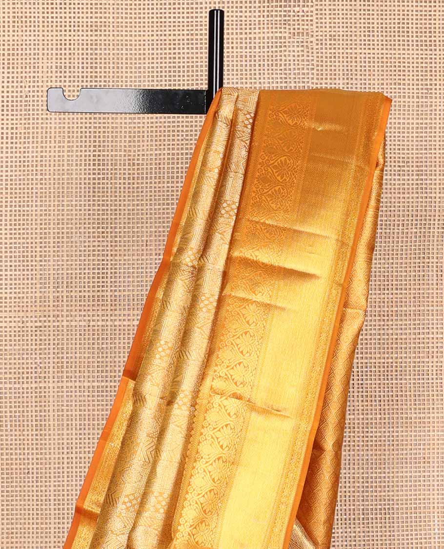 Orange jacquard tissue silk saree, jaal pallu & zari border of thilakam mokku, muthu, kathir & jadai nagam