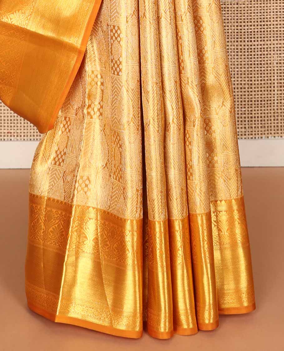 Orange jacquard tissue silk saree, jaal pallu & zari border of thilakam mokku, muthu, kathir & jadai nagam