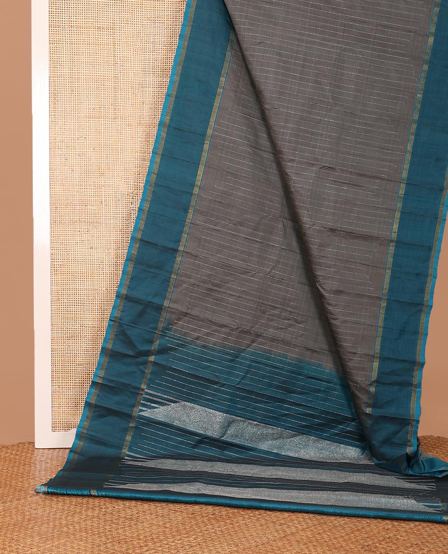 Dark grey striped Kanchipuram silk saree, contrast rettai pettu striped border, and temple zari pallu