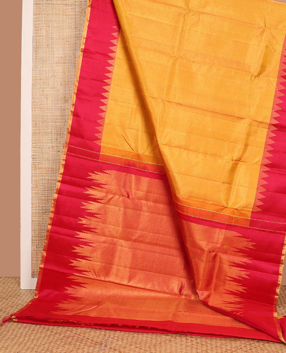 Yellow zari woven Kanchipuram silk saree, contrast thazampoo rekku zari border, and zari elevated pallu of pillaiyar mokku design