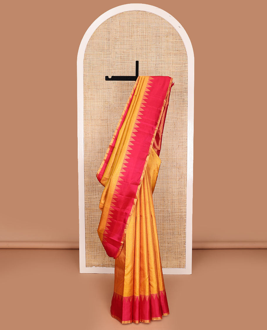 Yellow zari woven Kanchipuram silk saree, contrast thazampoo rekku zari border, and zari elevated pallu of pillaiyar mokku design