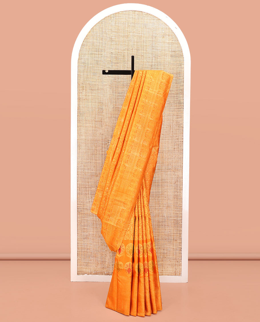 Orange Kanchipuram Designer Silk Saree, Subtly Sparkled With Floral Jacquard Design On Its Body, Highlighted by Meenakari Mughal Intricate Border, Intricate Pallu and Paired with a Matching Blouse