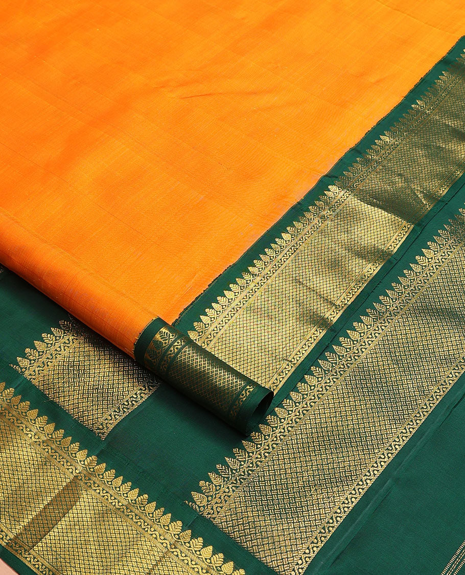 Orange plain nine-yard silk saree, contrast border of thilakam mokku, neli and paiyadi kattam designs, and pallu of zari designs
