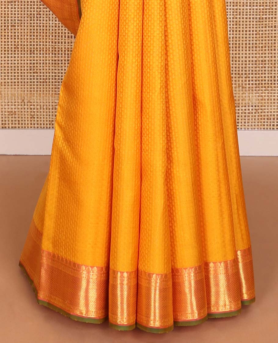 Orange floral design silk saree with contrast border of thilakam mokku, paun, vanki design & floral pallu