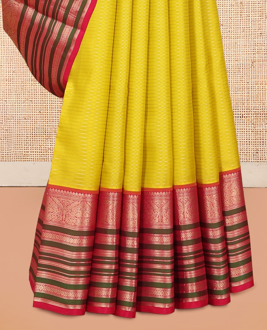 Yellow Vasundhara Silk Saree Adorned with Muthu Stripes All Over Its Body, Contrast Border of Thilakam Mokku, Muthu, Banaras, Mayil, Kamalam, and Neli Designs, Intricate Pallu, and Paired with a Contrast Blouse