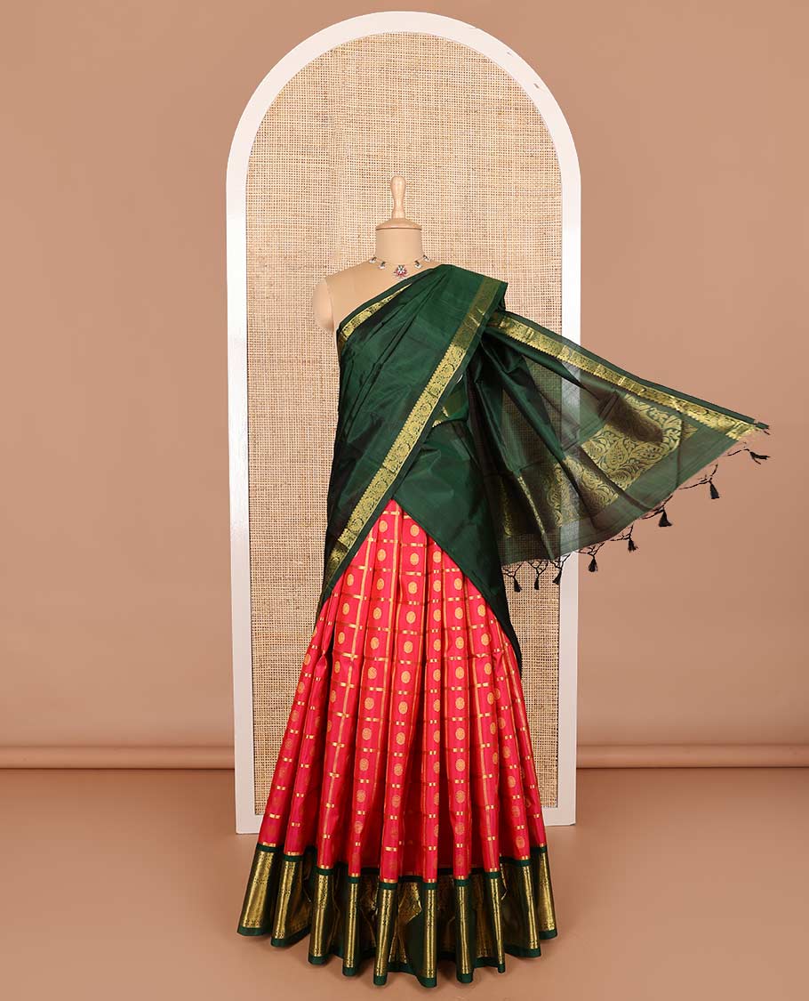 Red pure silk half-saree, chakram enclosed zari checked skirt, contrast border of muthu, poun, arumbu manga and mayil kann, and contrast zari design blouse, and leaf jaal dhavani