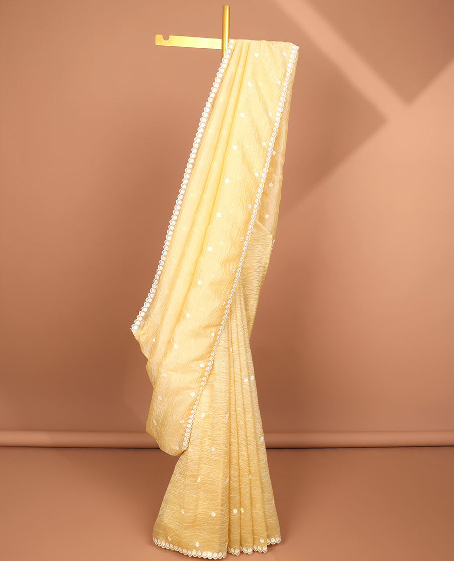 Light yellow floral thread embroidery tissue saree with floral scallop thread embroidery border