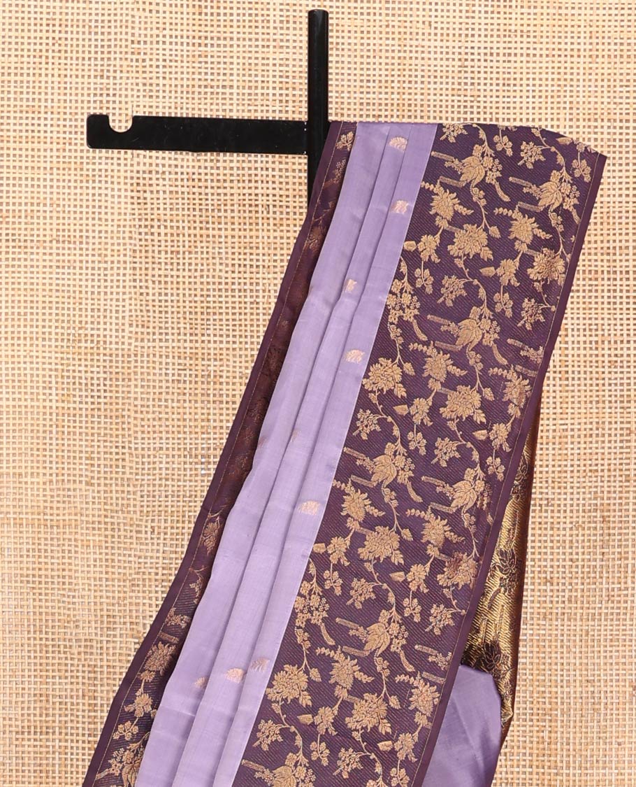 Lavender Vasundhara Silk Saree, Ornamented with Zari Buttas on Its Body, Complemented by Contrast Zari Border of Floral Jaal Designs, Gracefully Embellished Pallu of Floral Jaal Designs, and Paired with a Contrast Blouse