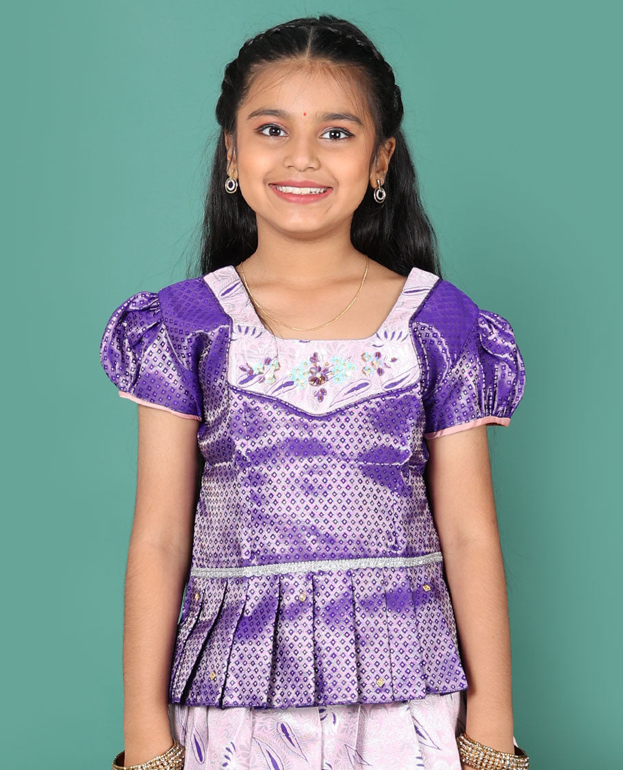 Baby pink readymade art silk pavadai, meenakari jacquard & contrast chakram zari border skirt, and contrast jacquard embroidered puff-sleeve blouse
