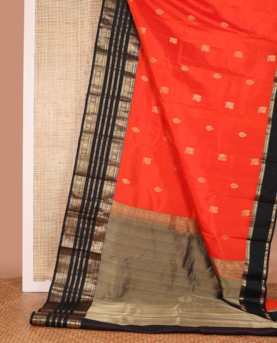 Orange zari buttas silk saree, contrast border of thilakam, Muthu, kathir, mayil kann and  mayil designs and geometric patterned pallu