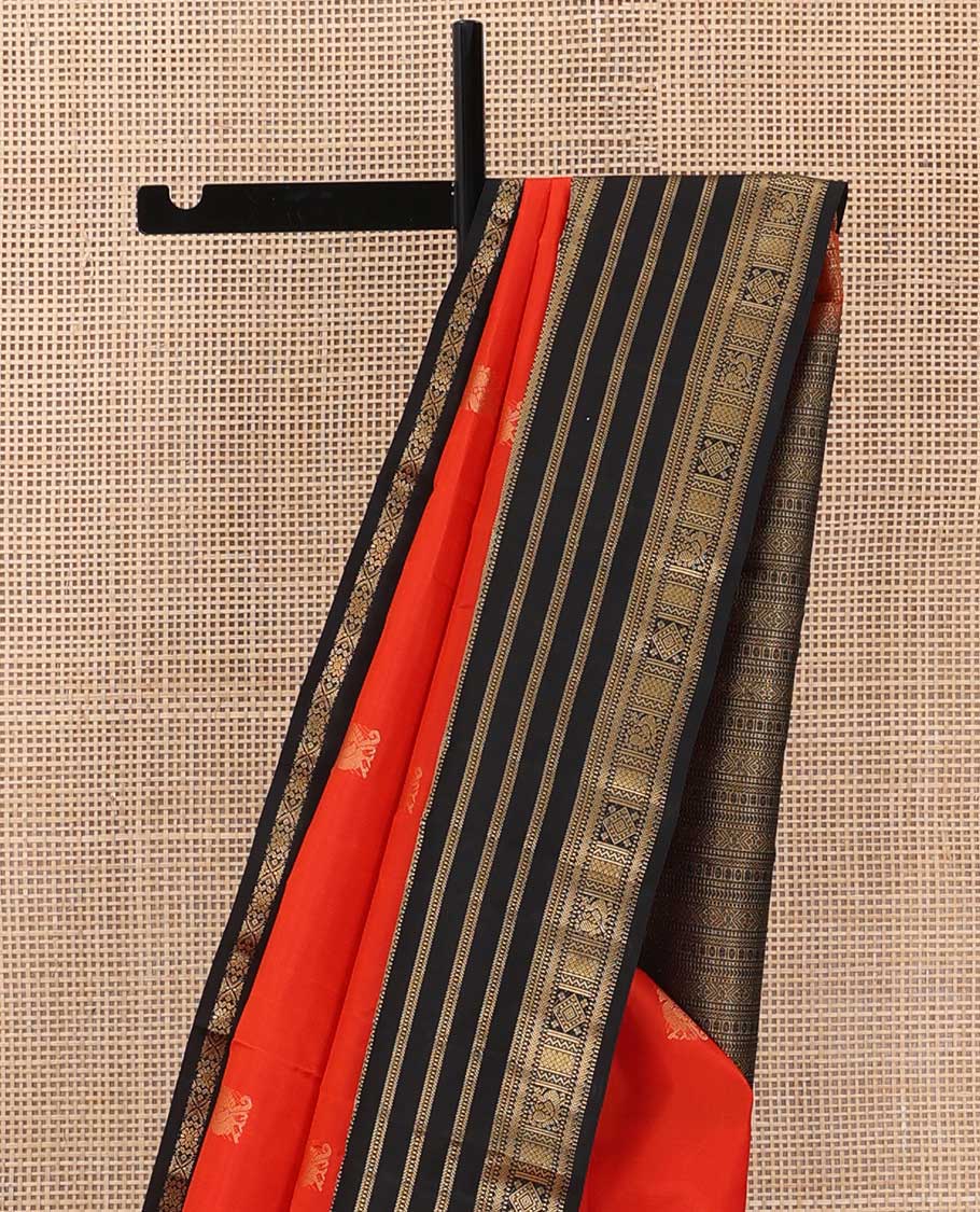 Orange zari buttas silk saree, contrast border of thilakam, Muthu, kathir, mayil kann and  mayil designs and geometric patterned pallu