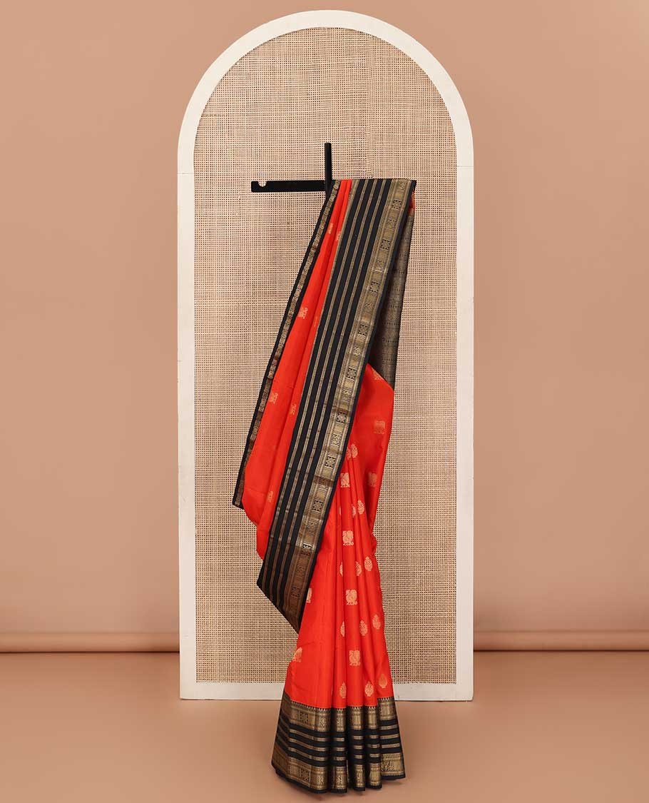 Orange zari buttas silk saree, contrast border of thilakam, Muthu, kathir, mayil kann and  mayil designs and geometric patterned pallu