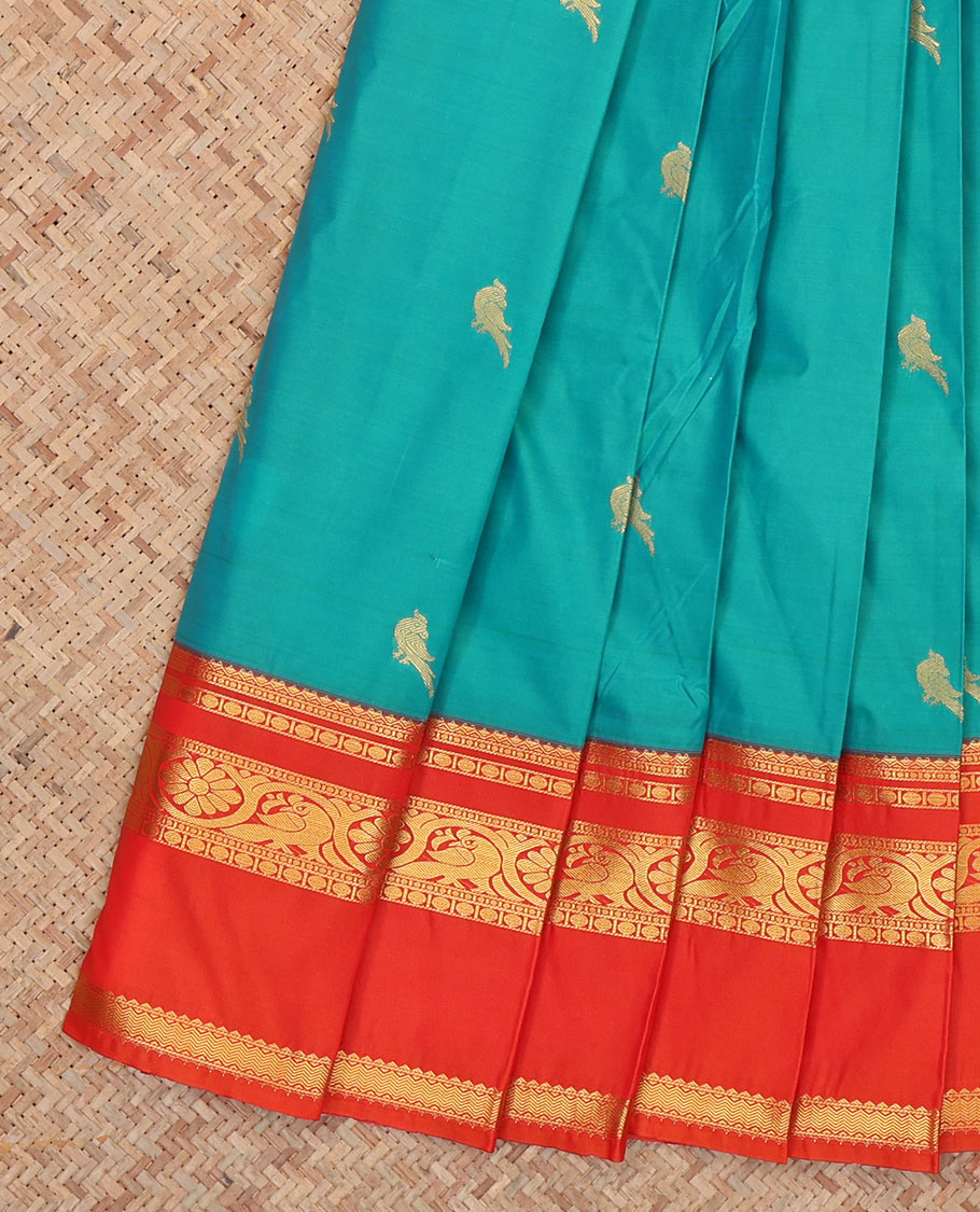 Blue Budget Silk Saree, Styled with Zari Buttas, Complemented by Contrast Traditional Rettai Pettu Border, a Jaal Pallu and a Contrast Blouse